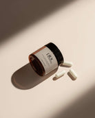 A jar of boric acid and 3 capsules by Pinc Wellness