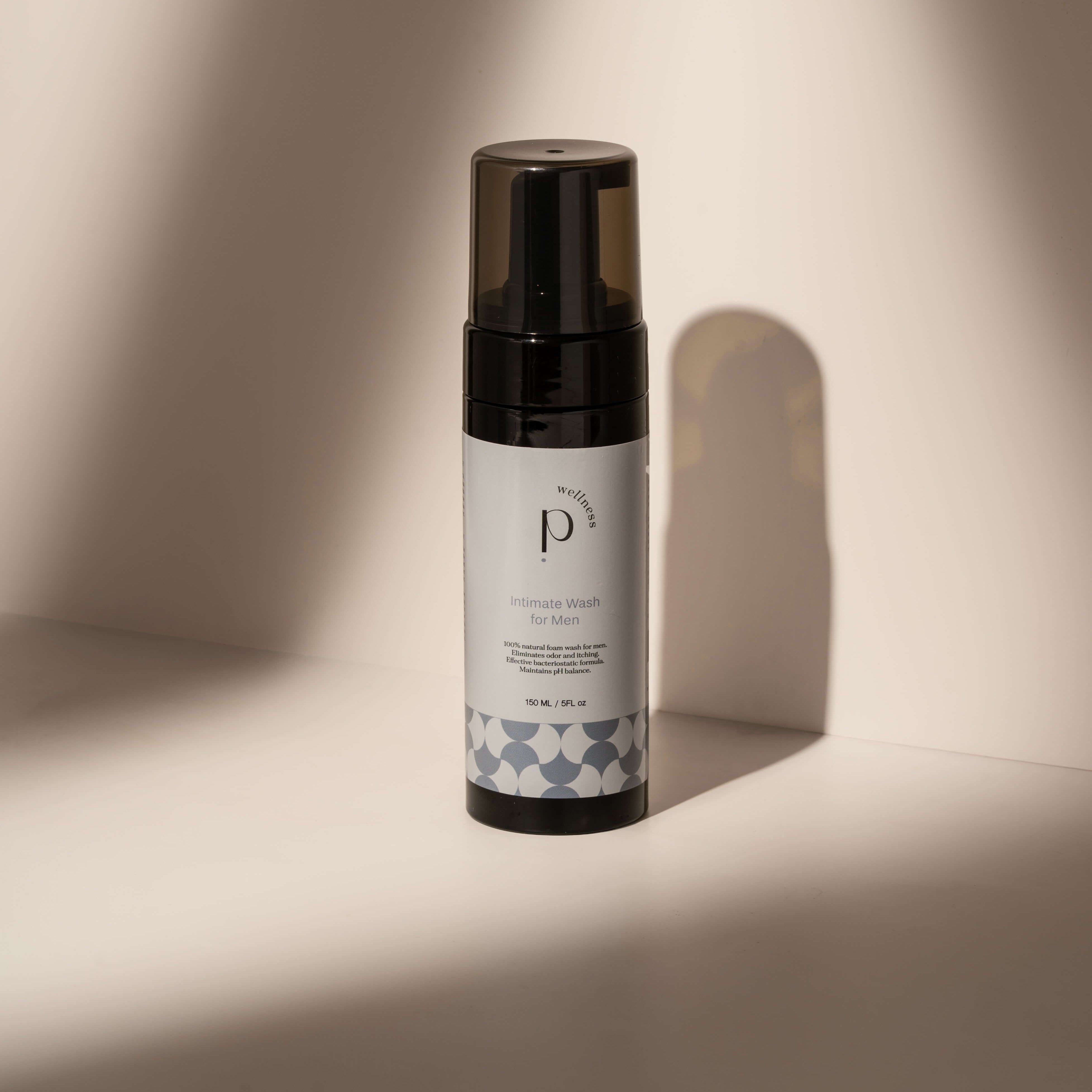 Male intimate wash bottle on a neutral background, designed for sensitive skin, promoting hygiene and comfort.