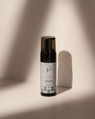 Intimate wash bottle on neutral background, soft shadows, minimalist aesthetic.