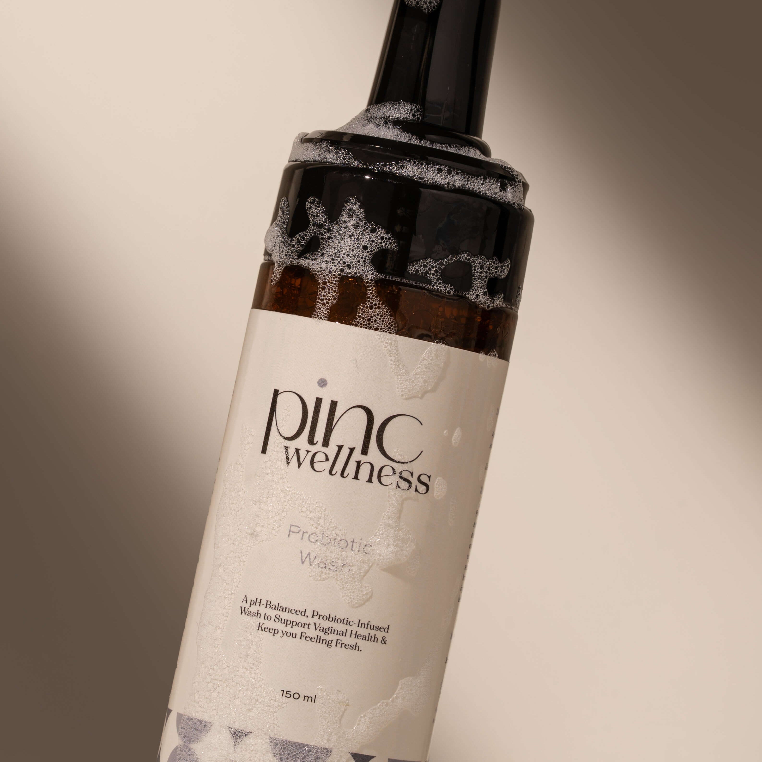 A close up of a bottle of probiotic intimate wash by Pinc Wellness