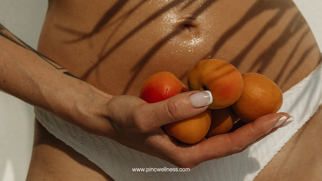 A picture of a women holding peaches