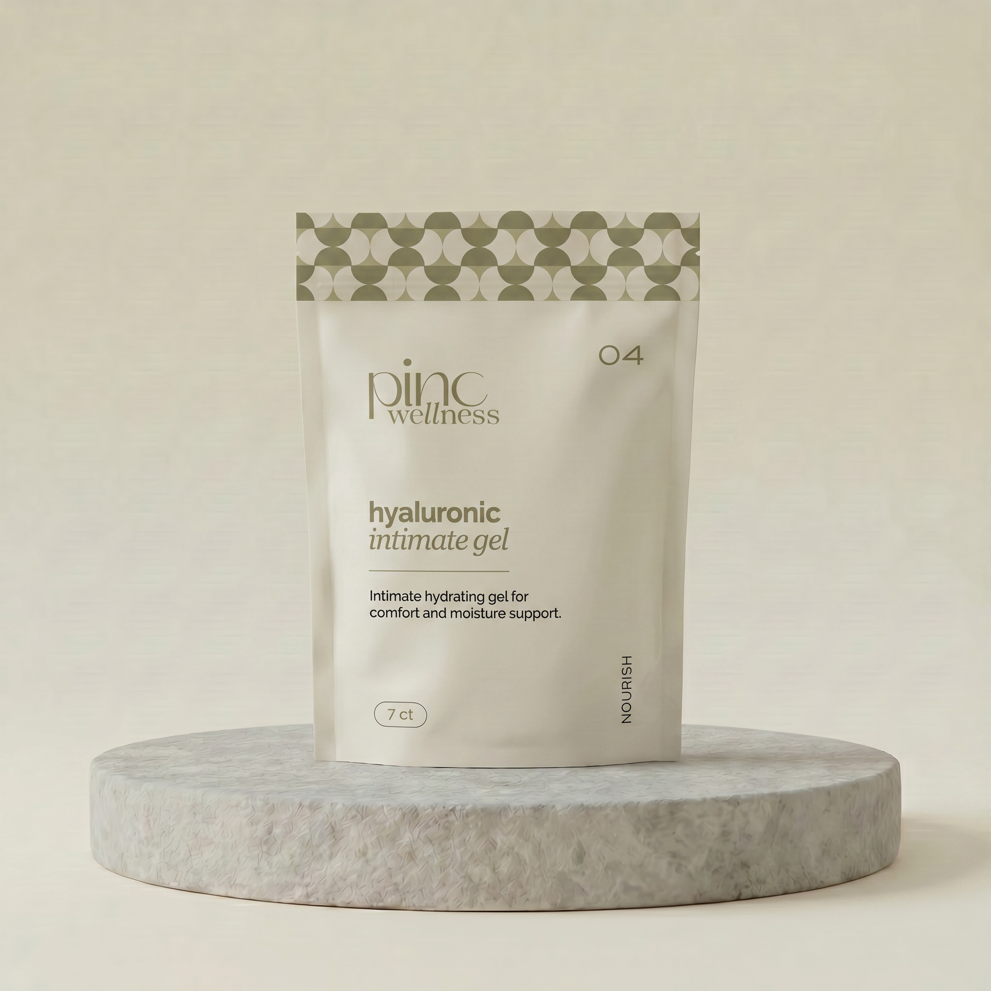 A stand-up pouch of Pinc Wellness Hyaluronic Intimate Gel, displayed on a round gray stone pedestal against a warm beige background.