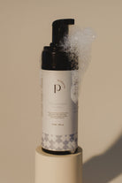 Pinc Wellness Intimate Wash for Men with soap dripping from the bottle