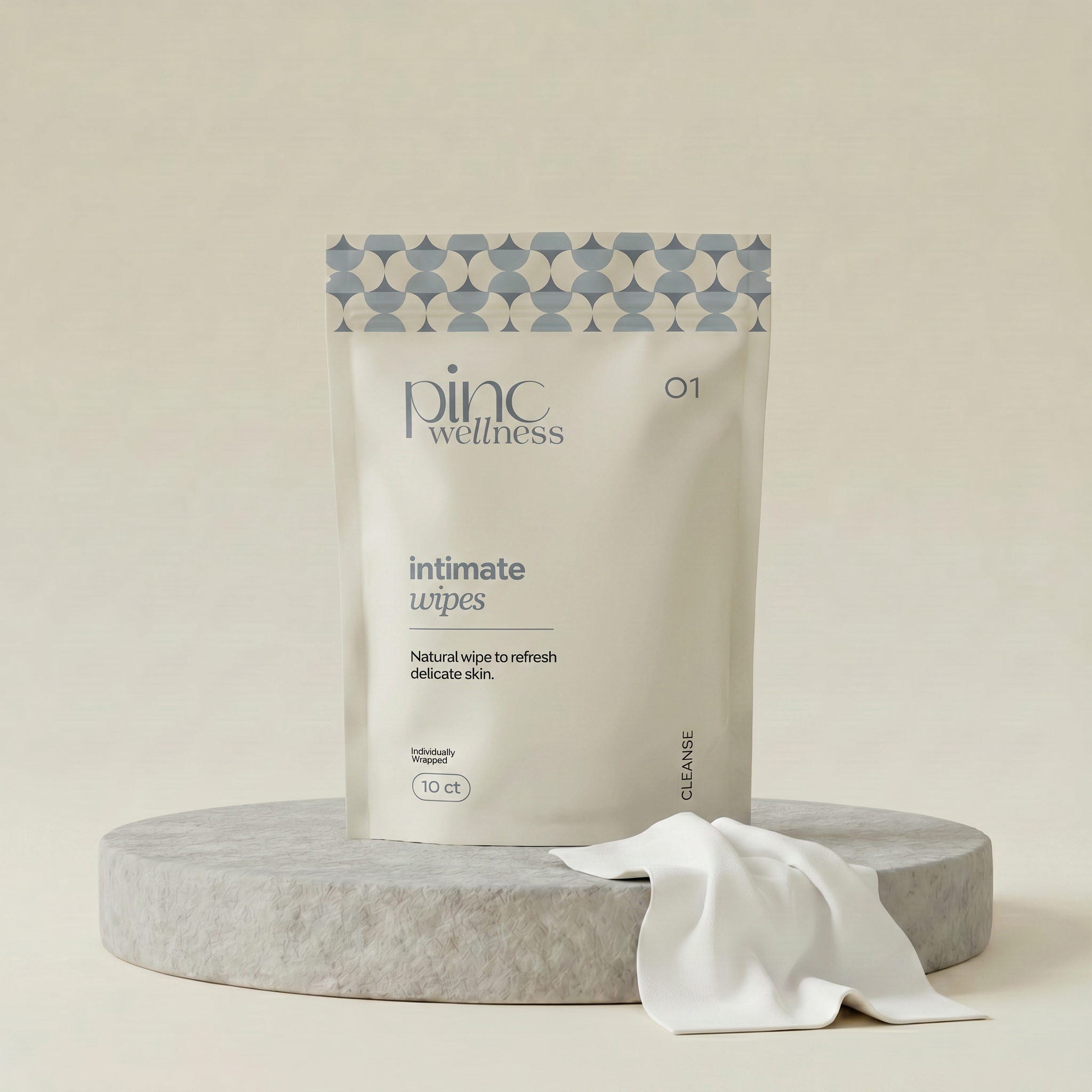 Package of 'pinc wellness' intimate wipes on a beige background