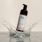 a amber jar bottle with black lid