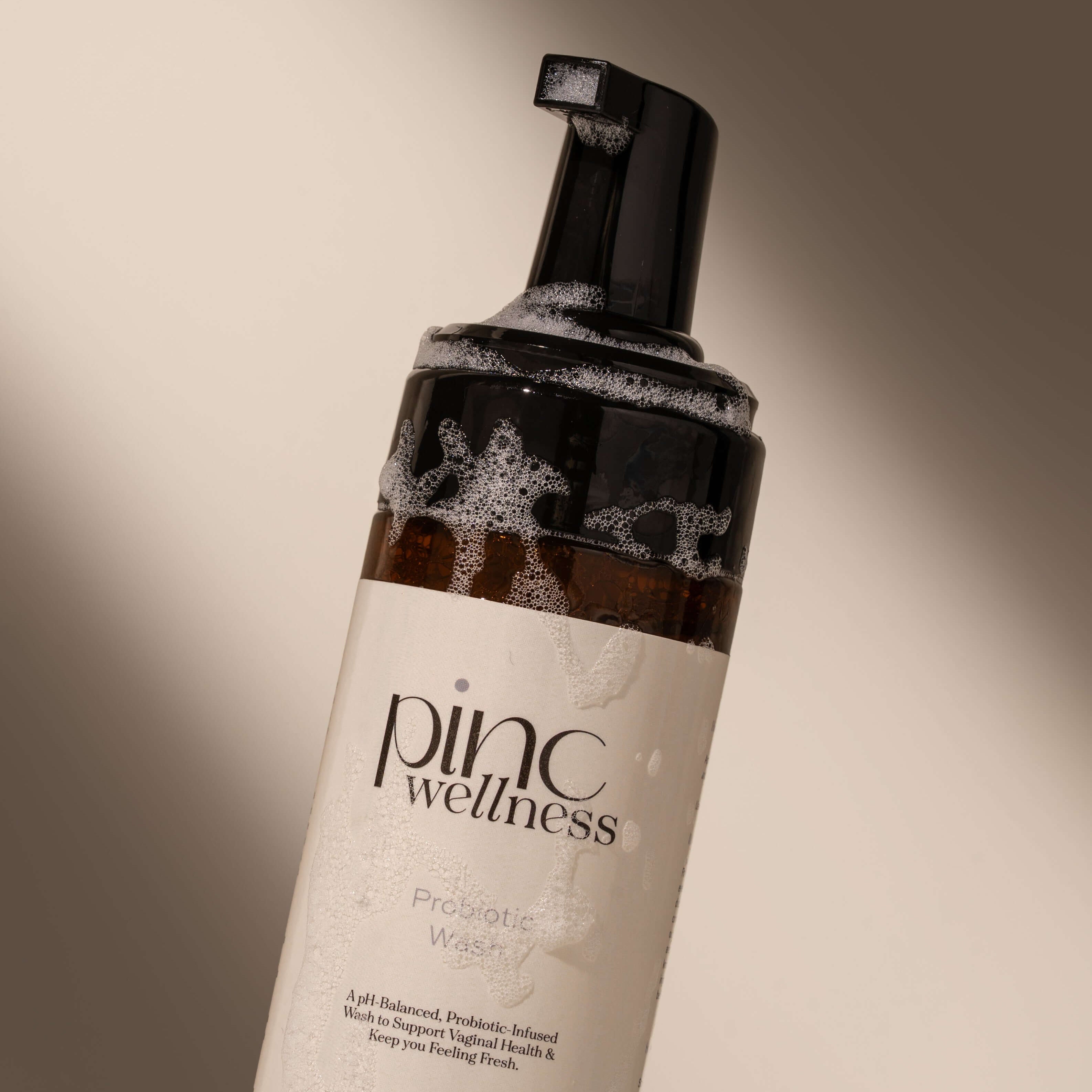A close up of a bottle of probiotic intimate wash by Pinc Wellness