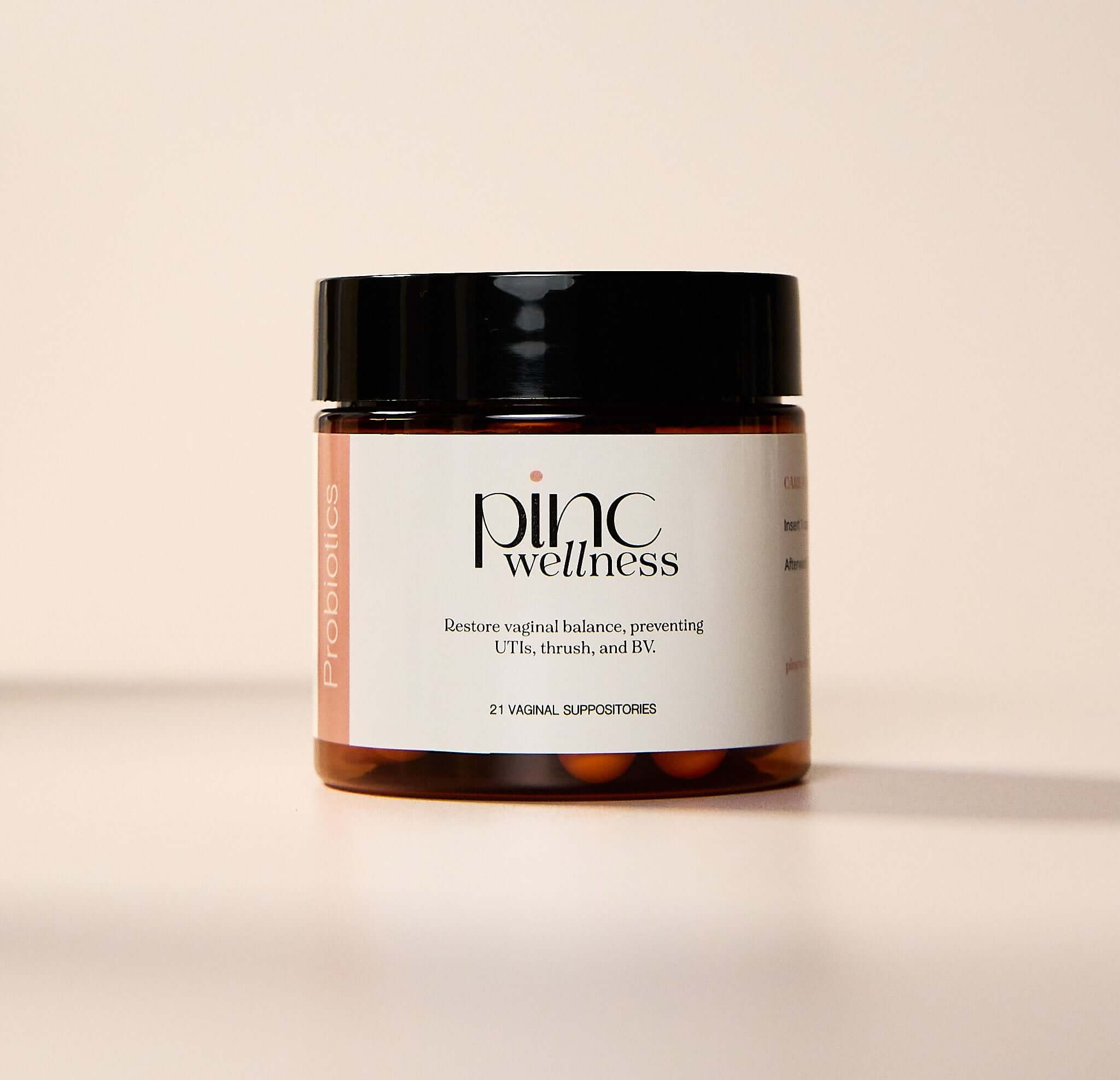 Pinc Wellness probiotics jar on pale background, vaginal health benefits.